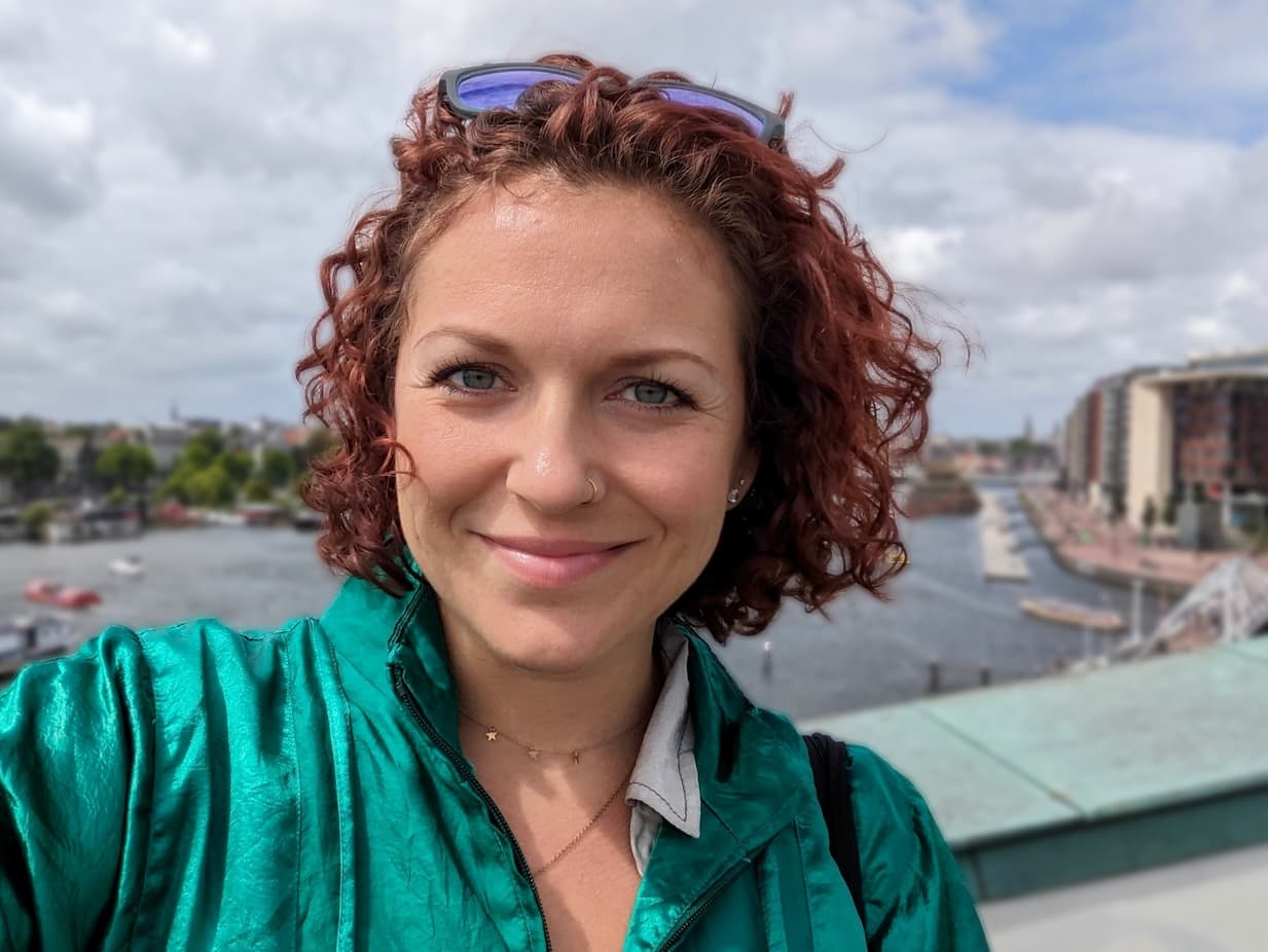 Photograph of Monique standing on a bridge